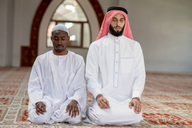 istock Two religious muslim man praying together inside the mosque 969294396