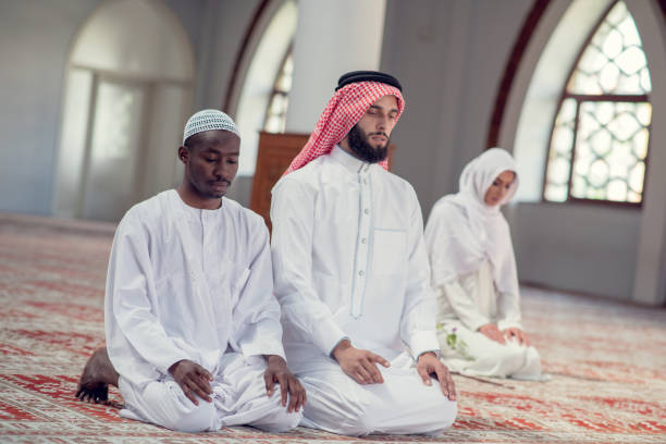 istock Two religious young people praying inside the mosque. islamic 969294502