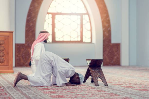istock Two religious muslim man praying together inside the mosque 969300322
