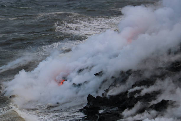 istock Lava flowing into the ocean 969302060