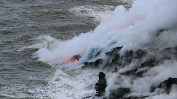 istock Lava flowing into the ocean 969303718