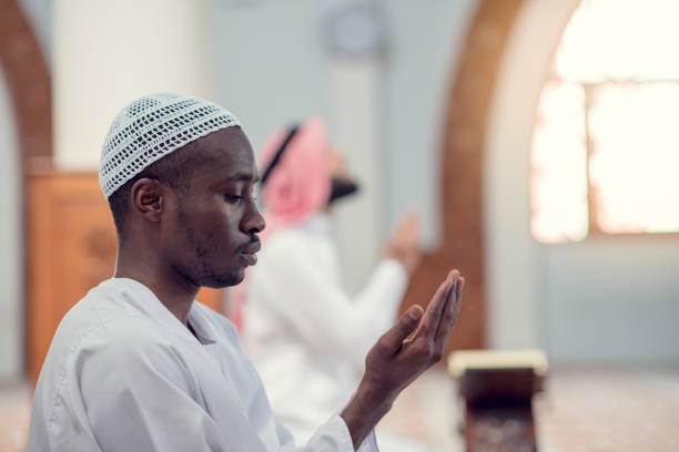 istock Two religious muslim man praying together inside the mosque 969307056