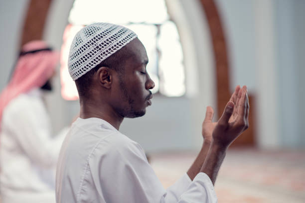 istock Two religious muslim man praying together inside the mosque 969310046