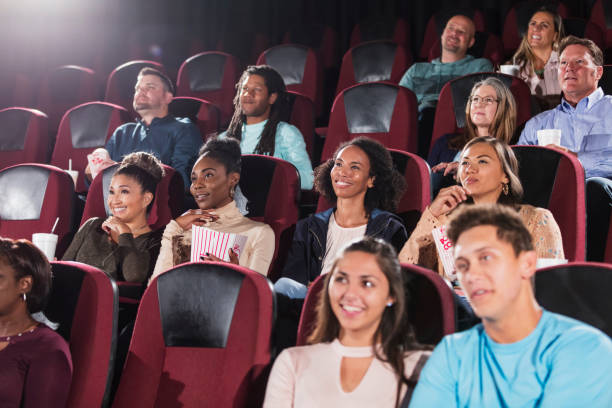 istock Multi-ethnic audience watching movie in theater 969310296
