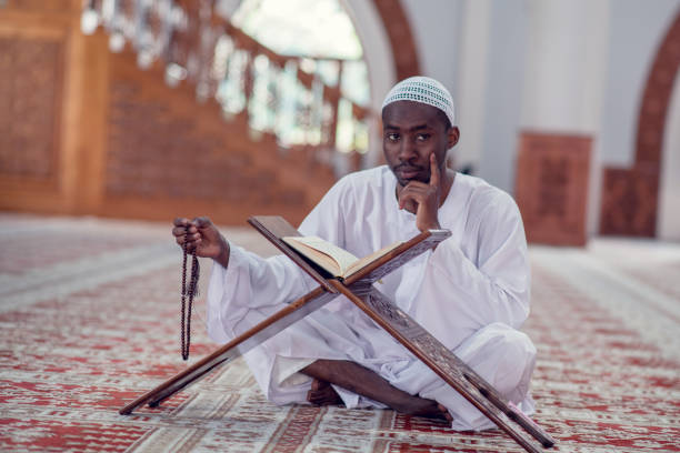istock African Muslim Man Making Traditional Prayer To God While Wearing Dishdasha 969310430