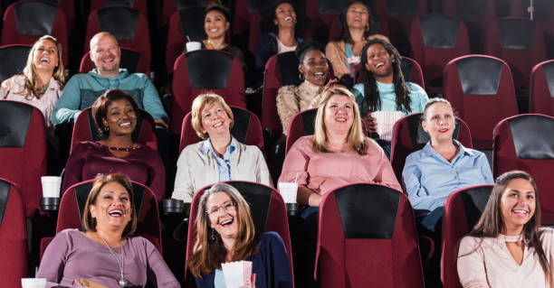 istock Multi-ethnic audience watching movie in theater 969311182