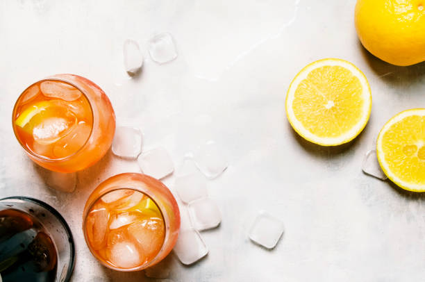 Italian Summer Cocktail Named Spritz Italian Summer Cocktail With Aperitif Named Spritz With Bitter, Ice, Sparkling Wine And Orange Slice, Top View Gin stock pictures, royalty-free photos & images