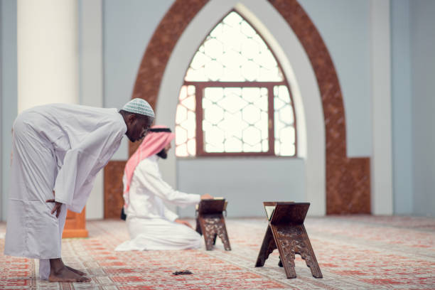 istock Two religious muslim man praying together inside the mosque 969314028