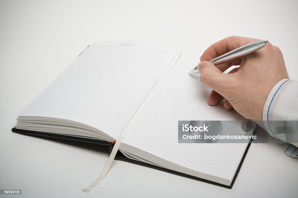 Hand writing on notebook Hand writing on notebook, white background, business concepts. Ballpoint Pen Stock Photo