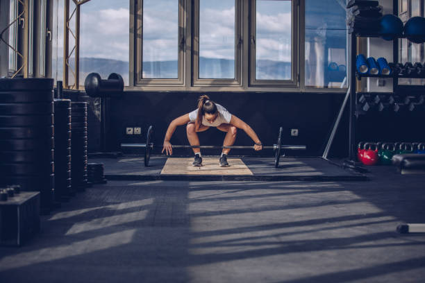 istock Woman on weightlifting training 969330834
