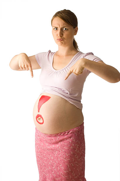 Pregnant brunette woman stock photo