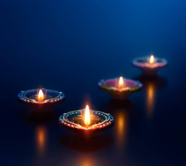 Colorful Diya Lamps Lit During Diwali Celebration Stock Photo - Download  Image Now - Diwali, Diya - Oil Lamp, Backgrounds - iStock
