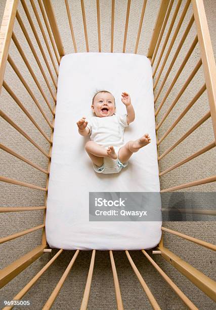 Aerial View Of A Happy Baby Girl In A Wooden Crib Stock Photo - Download Image Now - Affectionate, Baby - Human Age, Beautiful People