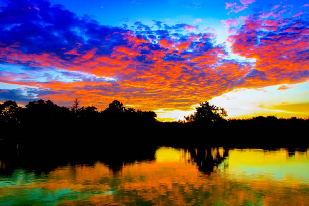 istock sunset beautiful colorful landscape and silhouette tree  reflex water river in sky twilight time with copy space add text 969352756