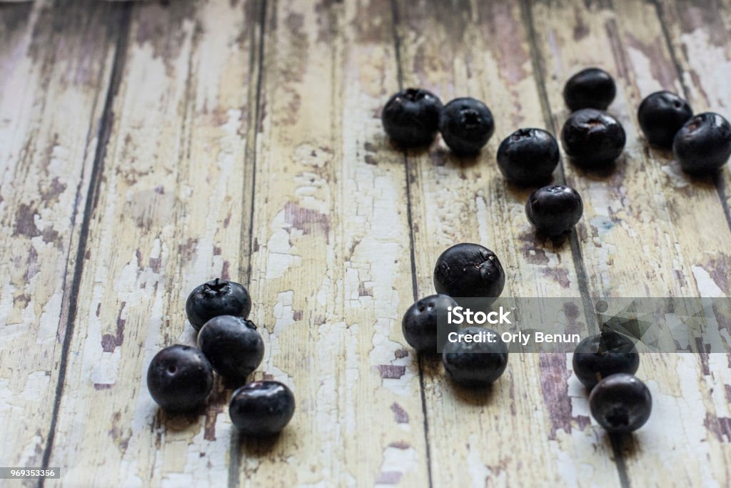 Blueberries Blueberries spread on a wooden garden table Berry Stock Photo