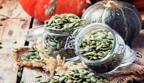 istock Raw pumpkin seeds, healthy snack 969358056