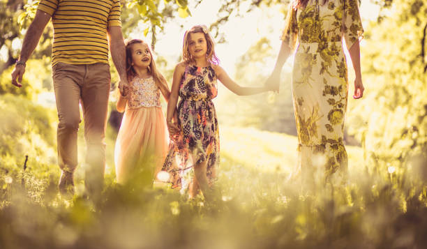 istock Happy family walking trough nature. 969360254
