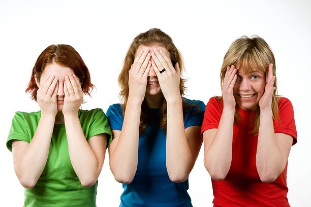 istock Female friends covering eyes 96936879