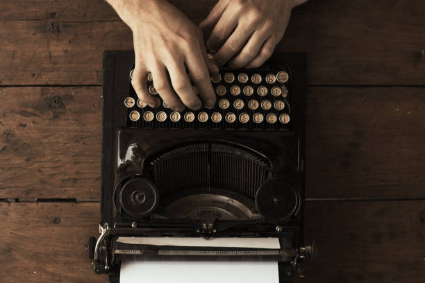 istock Young man's hands typing on an antique vintage typewriter 969369350