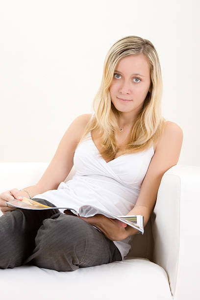 istock Teenager with magazine 96937062