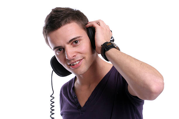 Casual man listening to music stock photo