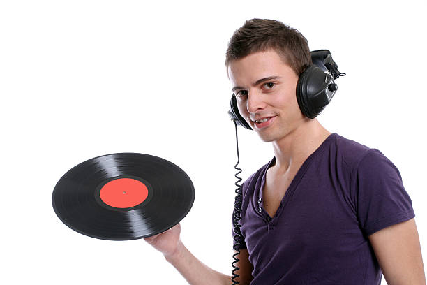 dj in headphones twisting a plate stock photo