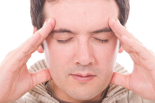 young man with headache stock photo