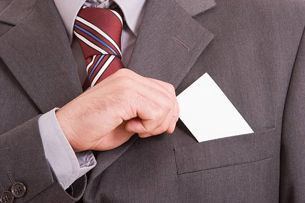 Business man offering card stock photo