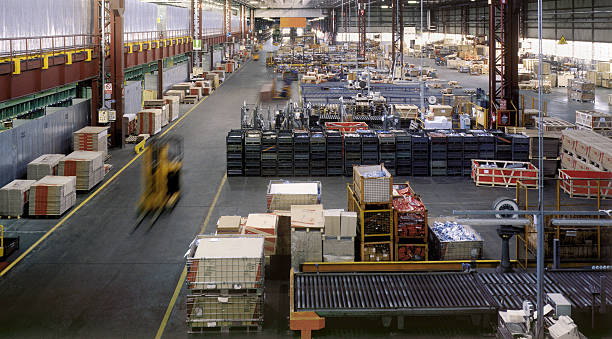Interior of a huge industrial warehouse during a daywork stock photo