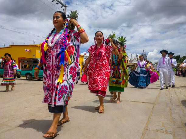 Local residents parading in colorful regional clothing. stock photo