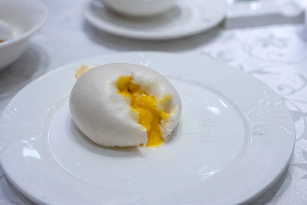 Custard lava cream bun flowing on white plate
