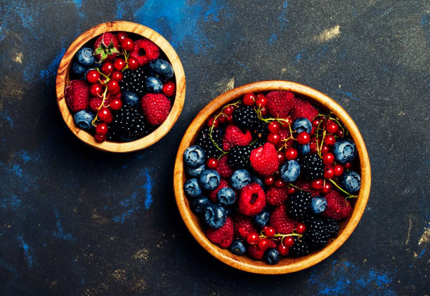 istock Summer berries in assortment, food background 969407698