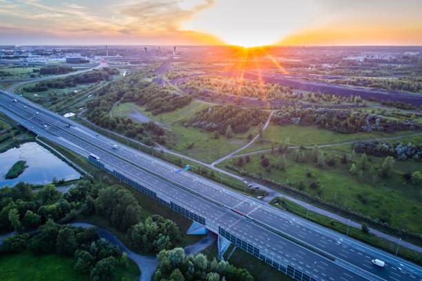 istock Aerial drone view on motorway and mine heap. 969414810