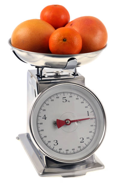 istock Kitchen balance on a white background with citrus fruits 969415222