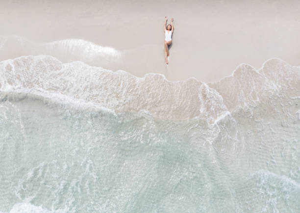 Woman Lying On a Beach