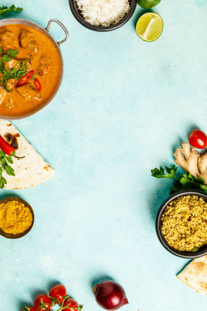 istock Traditional curry and ingredients on blue background 969427862