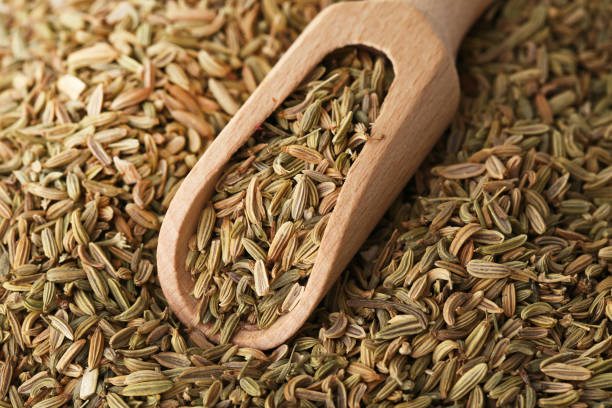 istock Heap of fennel seeds background 969435150