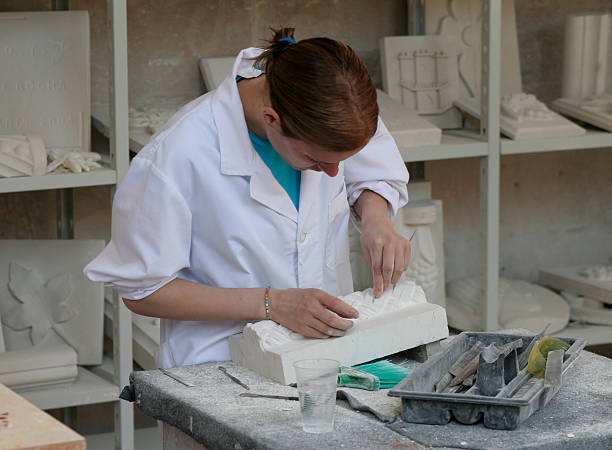 archeology student working on a relief stock photo