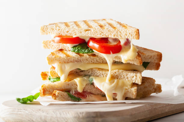 istock grilled cheese and tomato sandwich on white background 969438882