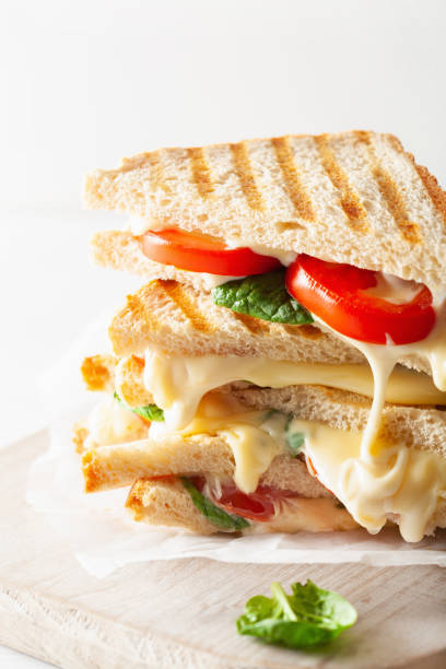 istock grilled cheese and tomato sandwich on white background 969439080