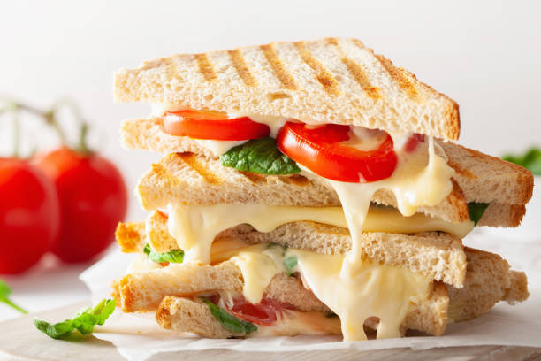 istock grilled cheese and tomato sandwich on white background 969439210