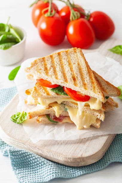 istock grilled cheese and tomato sandwich on white background 969441616