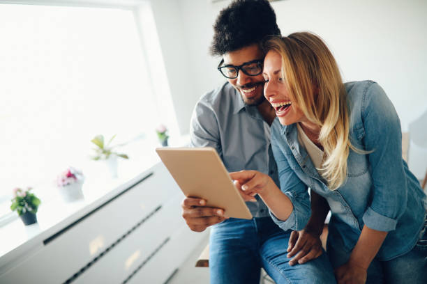 istock Happy couple in love surfing on tablet 969453718