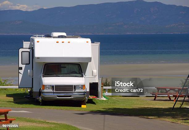 Campervan Parked By The Side Of The Sea Stock Photo - Download Image Now - Beauty In Nature, Blue, Camping