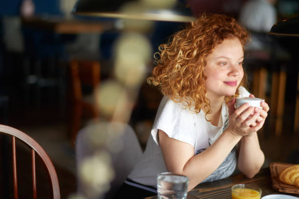 istock Woman in coffee shop 969457754