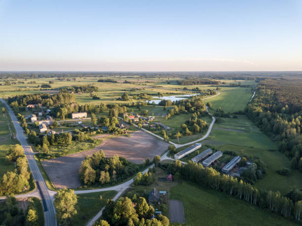 istock drone image. aerial view of countryside road network, cultivated fields and forest textures 969461232