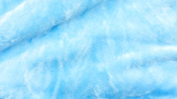 istock Close up of blue soft fabric for a background. 969464154