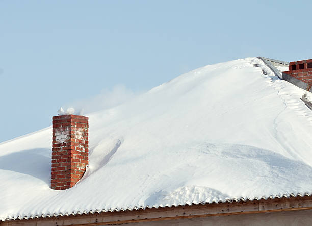 istock Snowbounded roof with old style red brick flue 96947344