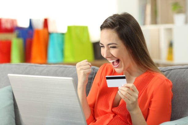 istock Excited shopper finding offers on line at home 969477376