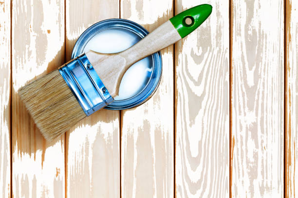 istock Paintbrush, paint jar, white, wooden background, Top view. Copyspace 969480456